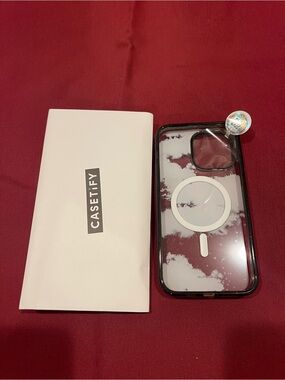 Casetify Clear MagSafe Case with White Cloud Print and Black Bumper